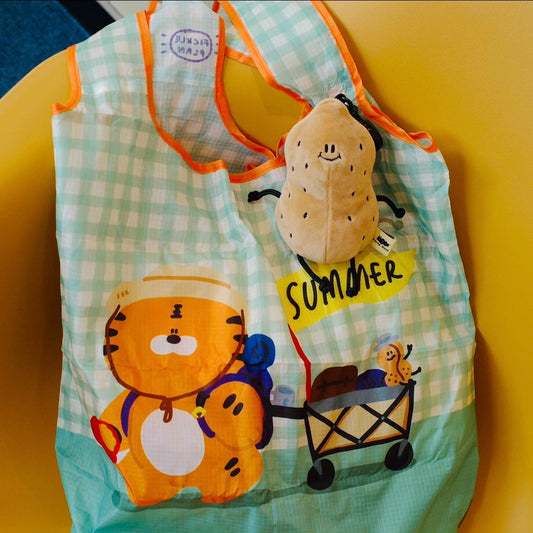 Children's apron with cartoon tiger design and 'summer' text on a yellow background