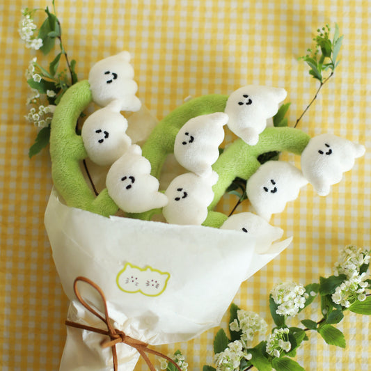 Bouquet of Convallaria Majalis on a yellow checkered background