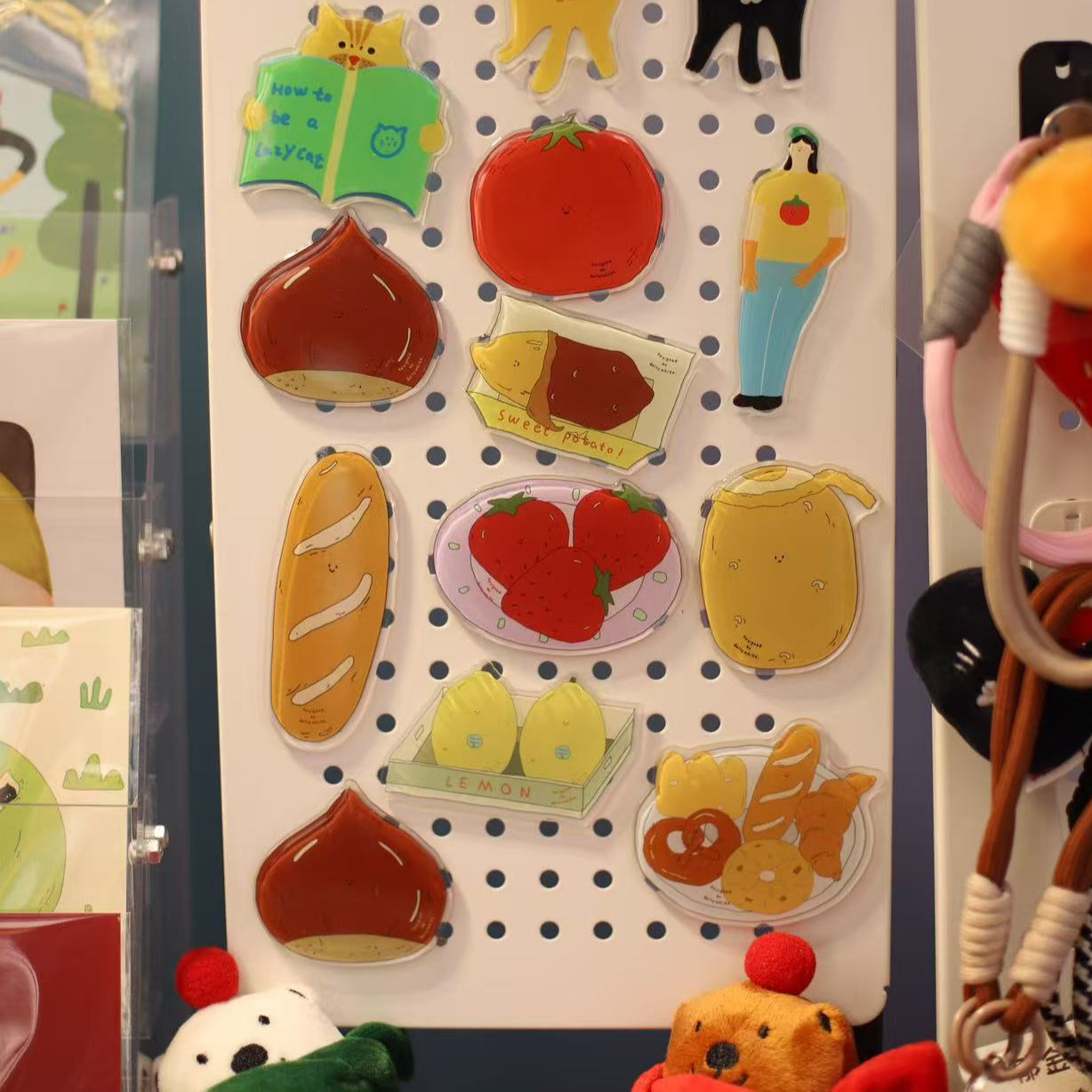 Set of colorful refrigerator magnets on a pegboard