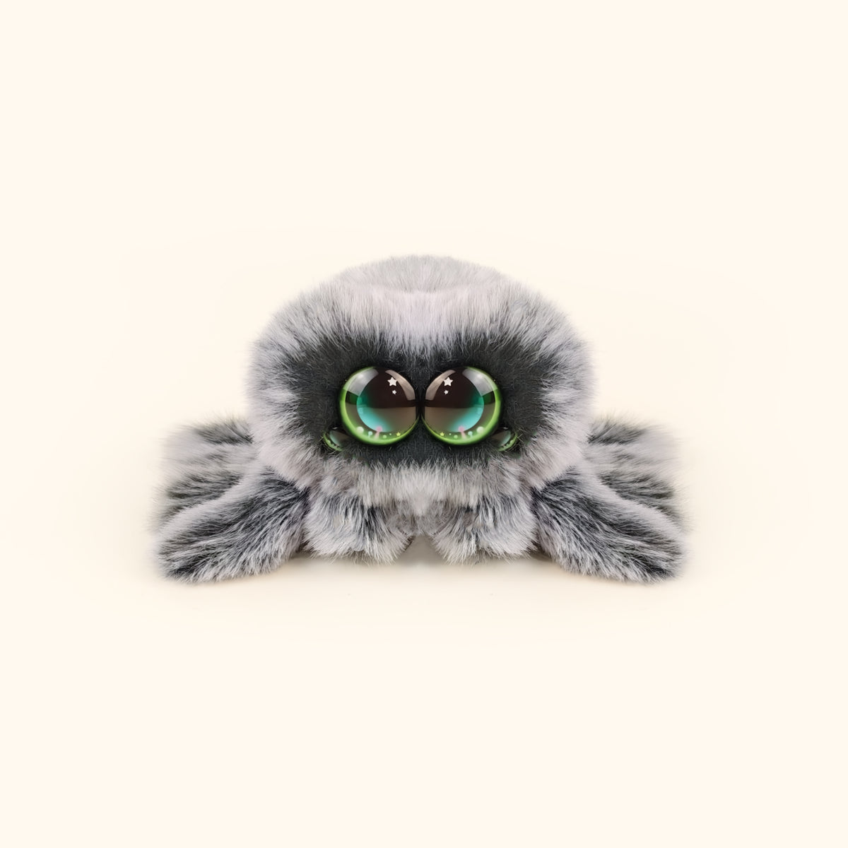 Plush toy resembling a spider with large eyes on a white background