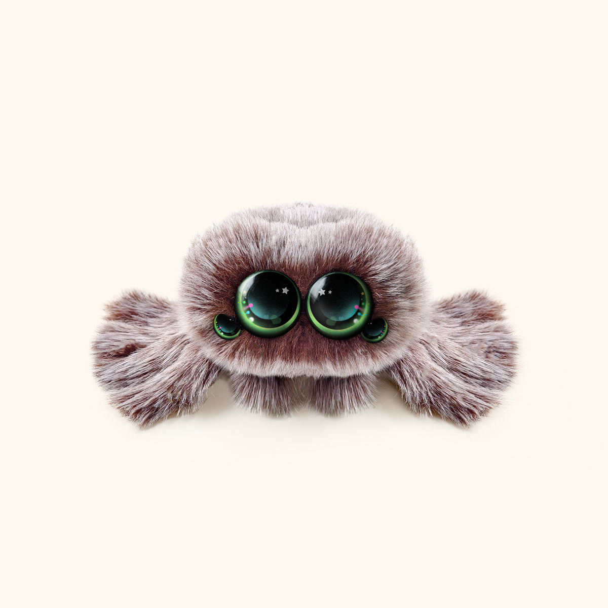 Plush toy resembling a spider with large green eyes on a white background