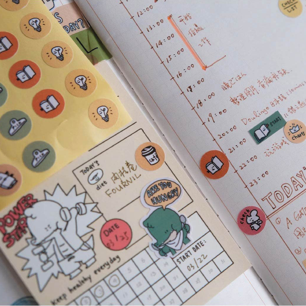 Notebook page with stickers and text, featuring a colorful design.