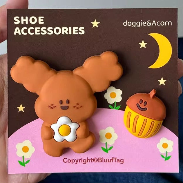 Shoe accessories packaging with cartoon character and cupcake on a brown background