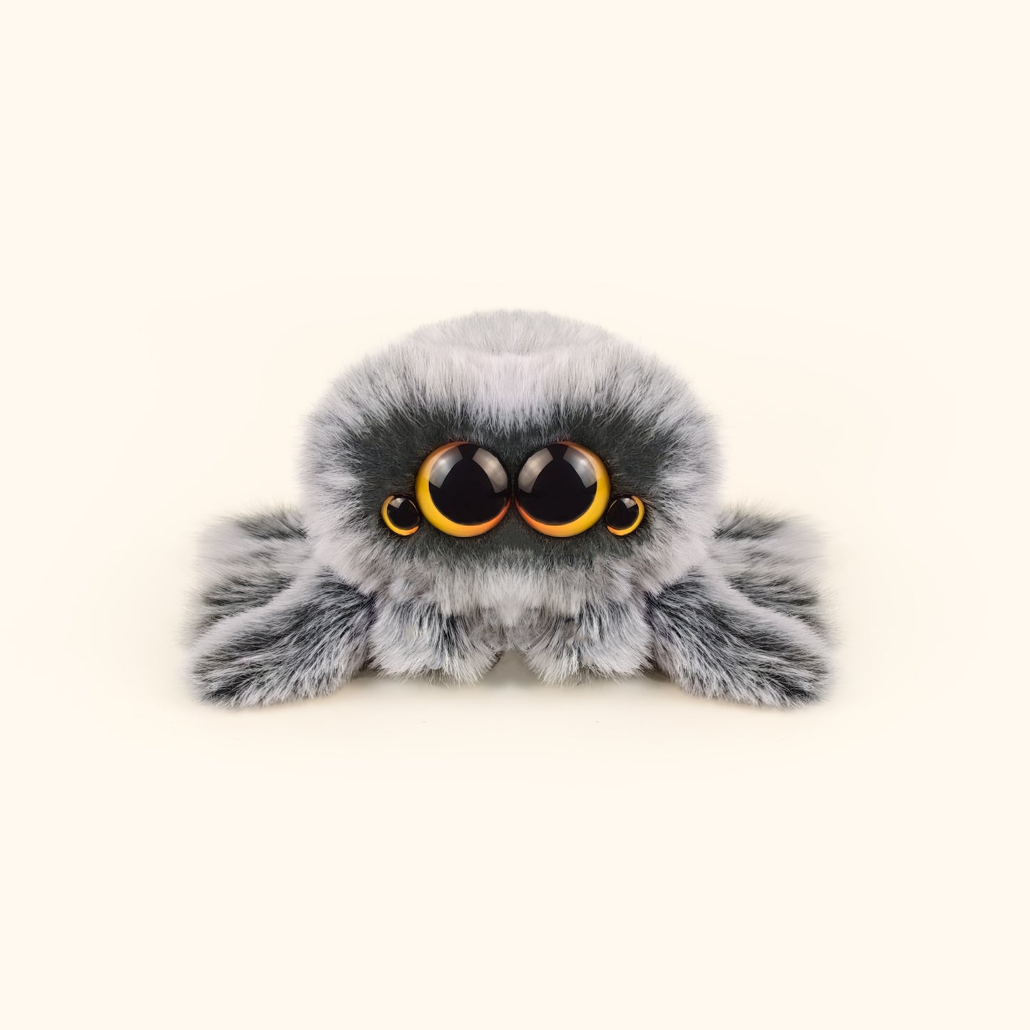 Plush toy spider with large eyes on a white background