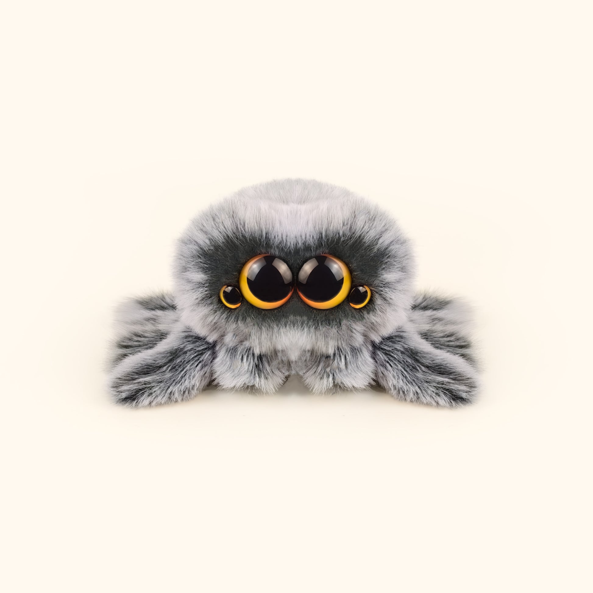 Plush toy spider with large eyes on a white background