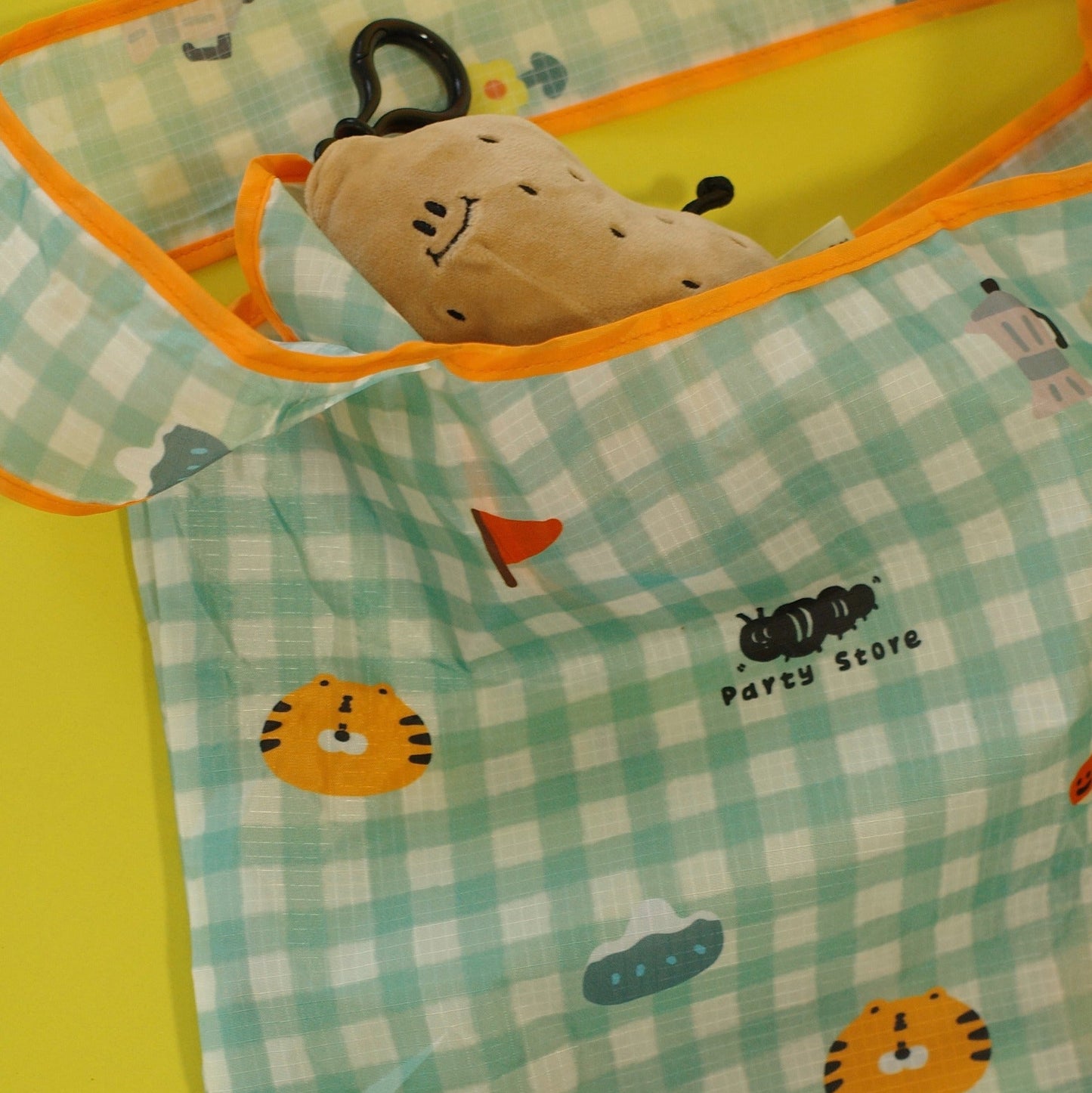 Children's blanket with cartoon characters and a plush toy on a checkered pattern