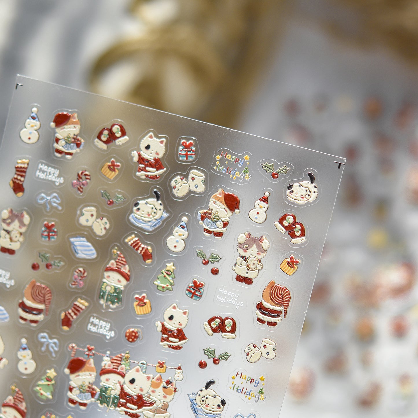 Sheet of Christmas-themed stickers with various designs on a clear background.