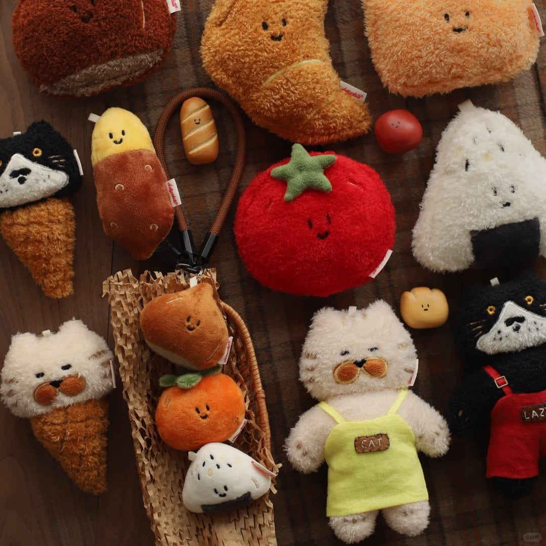 Collection of cute plush toys resembling food items on a wooden surface