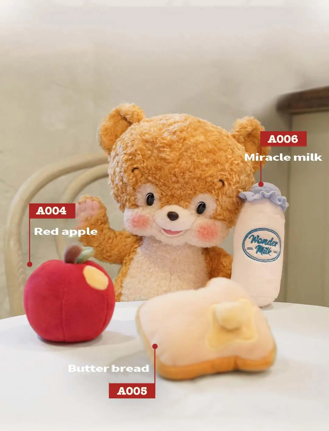Plush toy bear with plush apple, bread, and bottle labeled 'Miracle milk' on a white surface.