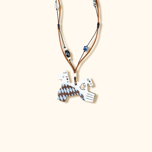 Necklace with a unique pendant on a beige background