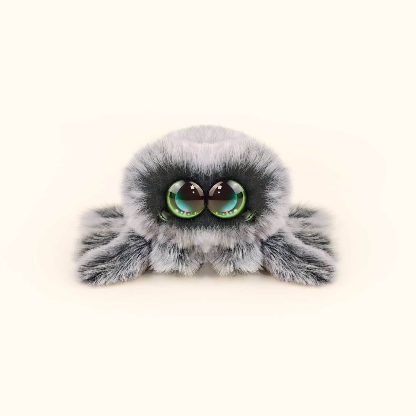 Plush toy resembling a spider with large eyes on a white background