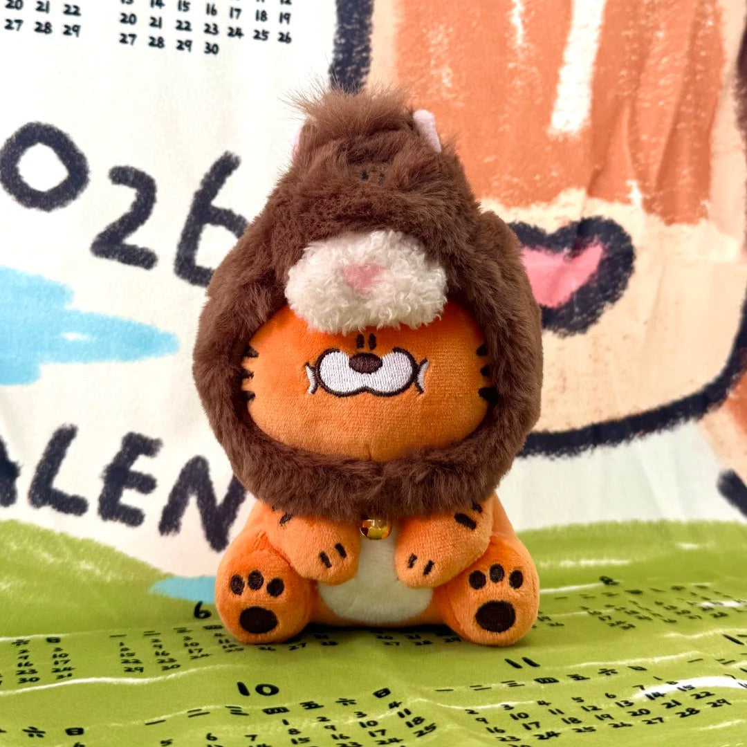Plush toy resembling a character with an orange body and brown mane on a colorful background